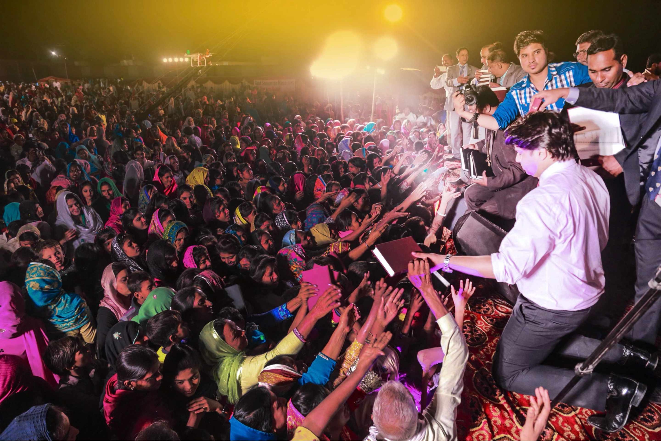 - Free Urdu Bibles Distribution | Giving Free Urdu Bibles Pastor handing out Free Urdu Bibles distribution to believers at an evangelistic event in Pakistan