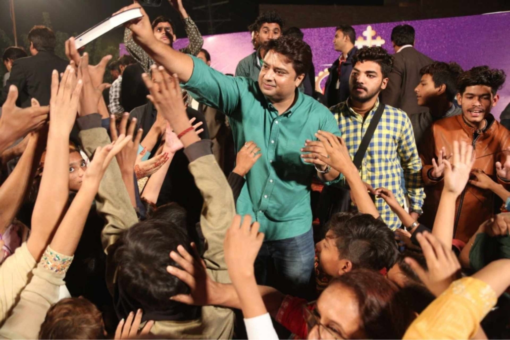 Free Urdu Bibles distribution during a Gospel crusade in Pakistan by Good Samaritan Ministries