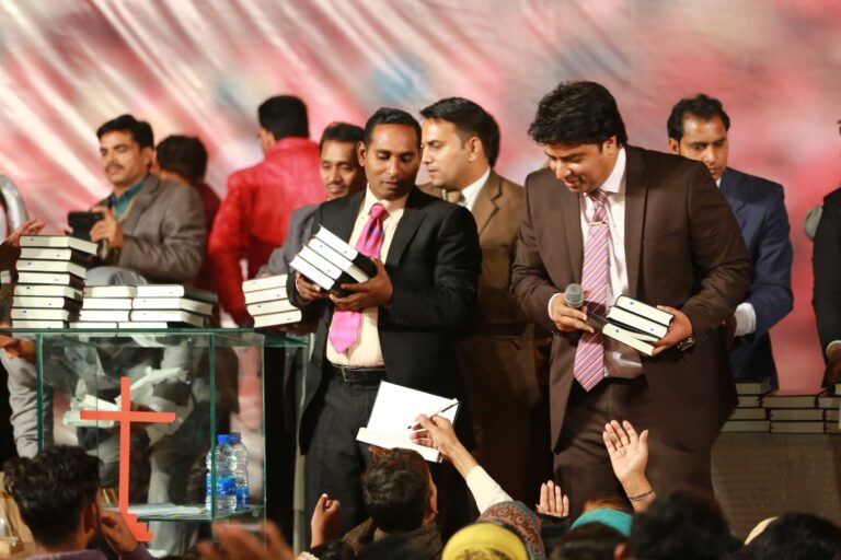 Distributing Free Urdu Bibles in Pakistan during revival crusade in Lahore Pakistan.